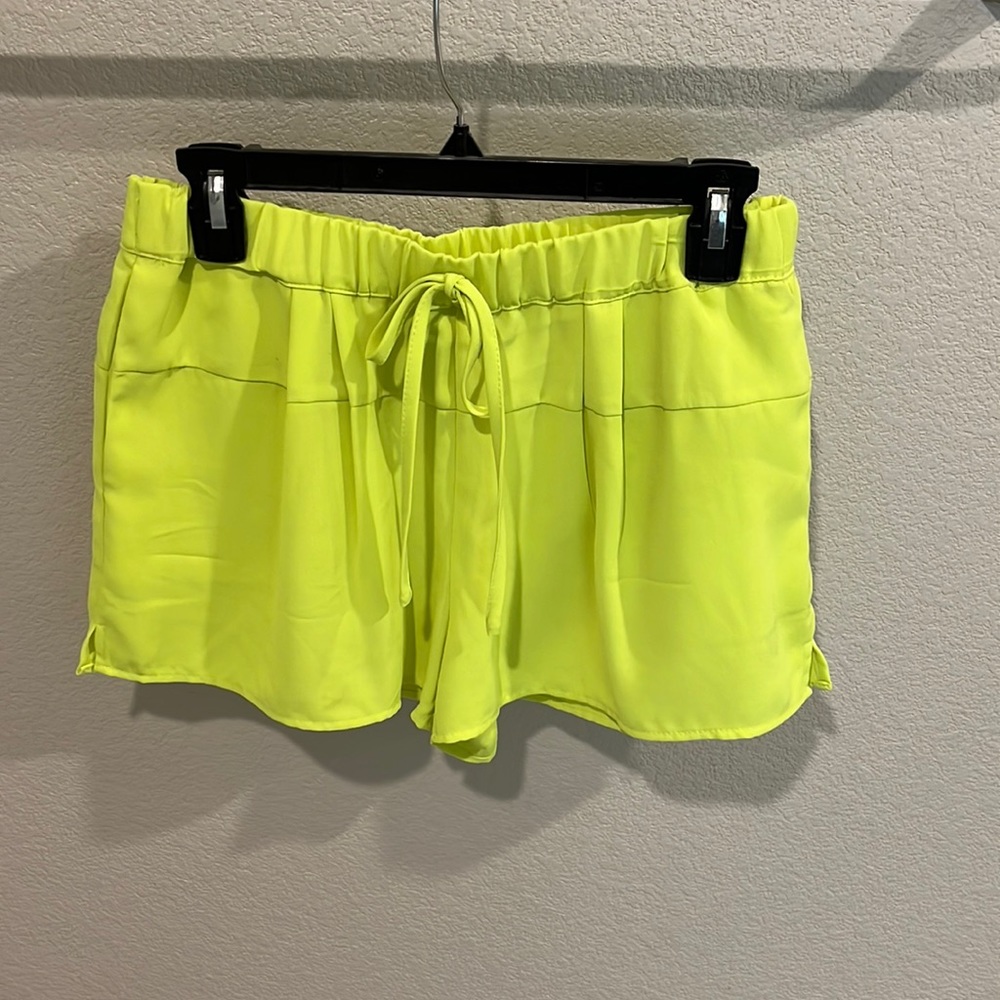 Neon green elastic waist shorts with pockets